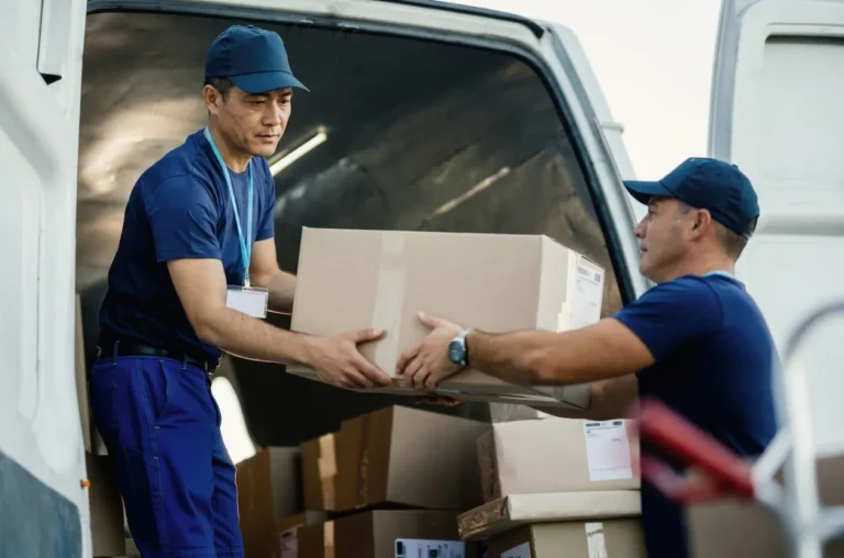 two-couriers-carrying-package